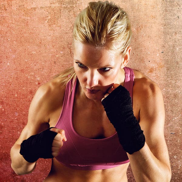 Mixed Martial Arts Lessons for Adults in Chicago IL - Lady Kickboxing Focused Background