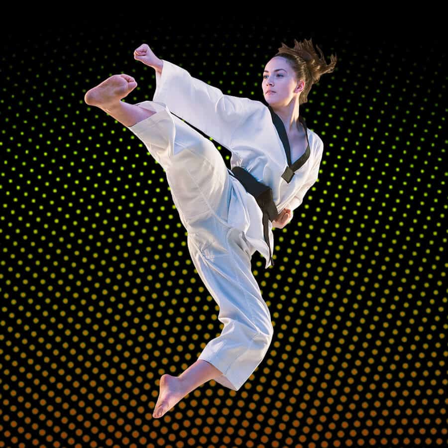 Martial Arts Lessons for Adults in Chicago IL - Girl Black Belt Jumping High Kick